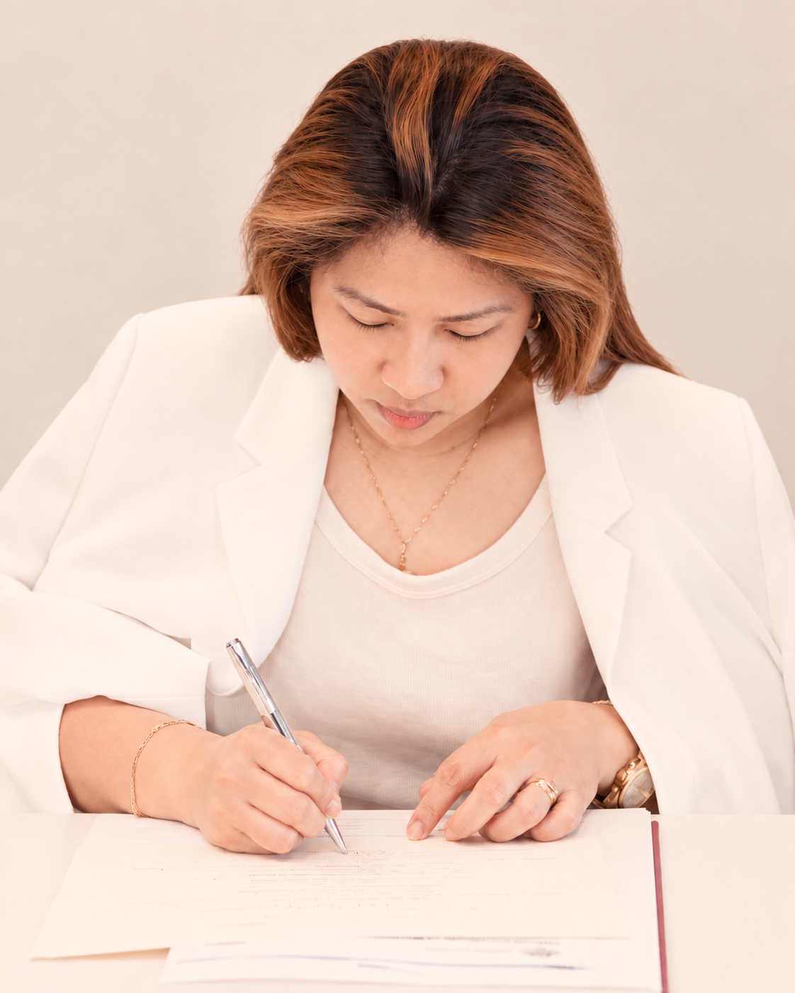 Rowena Roque, founder of The Kairos, writing in a notebook