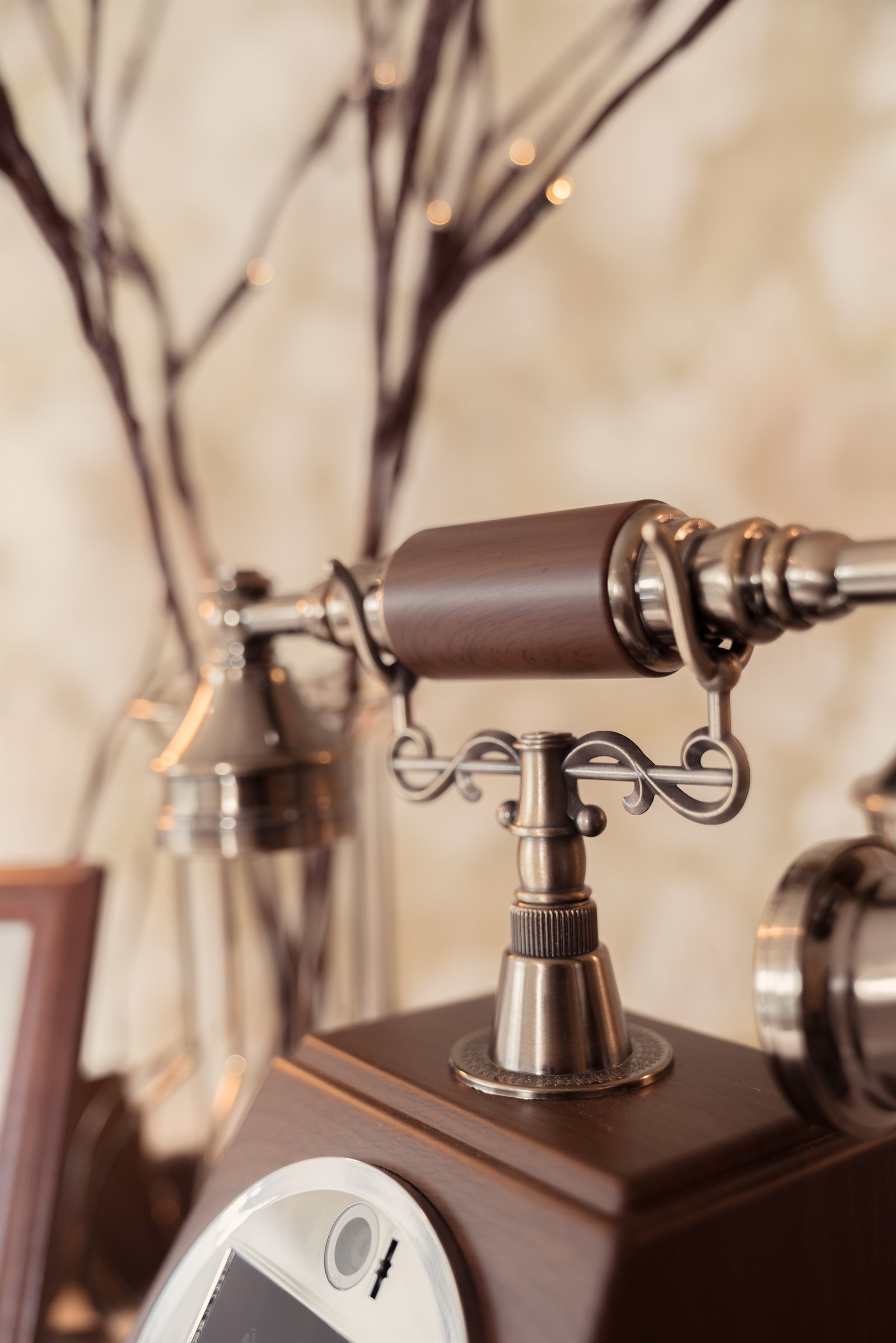 Close-up of the Heirloom wooden telephone receiver and vintage metal cradle