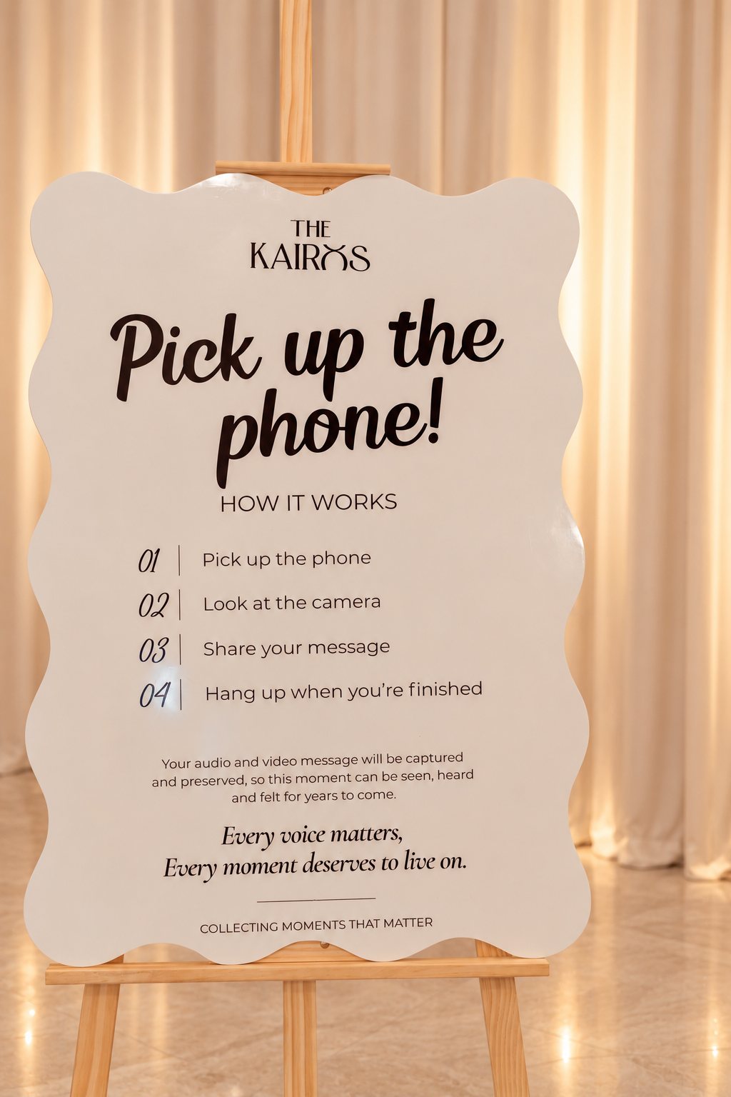The Kairos Pick up the phone sign on a wooden easel, explaining how to leave an audio and video message